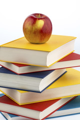 apple on a stack of books