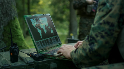 Military Operation in Action, Soldiers Using Military Grade Laptop Targeting Enemy with Satellite....