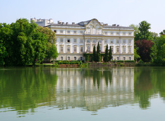Reflections of Leopoldskron Palace and Hohensalzburg Fortress on the Lake Leopoldskroner Weiher, Salzburg, Austria