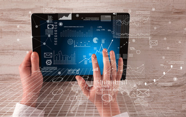 Business hands holding tablet