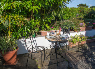 Patio and table set for lunch in the summer.