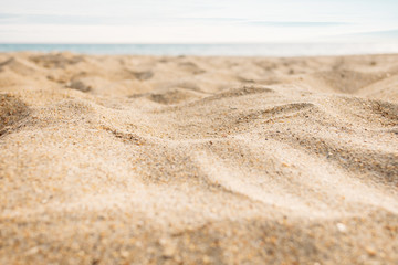 Fototapeta na wymiar View of the sea sand, close-up.