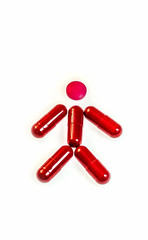 Red capsules pills on white background