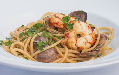 Spaghetti with shrimps and clams with parsley.