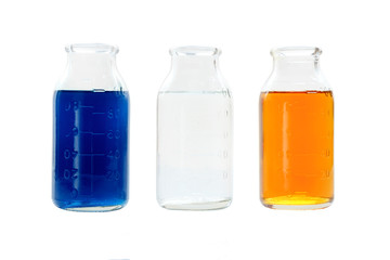 chemical vessels with colorfull liquids on white background isolated