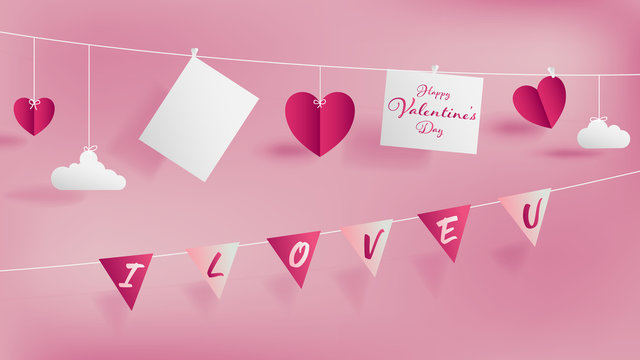 Valentine 's day paper craft concept contain two white strings, top hanging empty paper for short note or your lover photo,bottom holding flags with text I LOVE YOU,Soft pink background