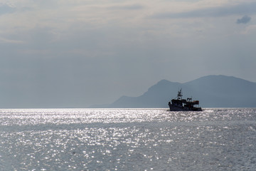 boat on the sea in the distance 