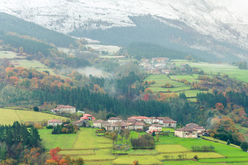 Fototapeta na wymiar rural village of basque country on foggy day, Spain
