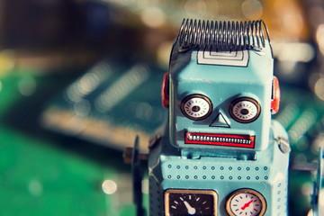 Vintage tin toy robot with computer board, artificial intelligence concept