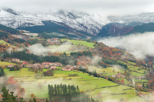 countryside town of basque country on foggy day, Spain