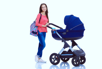 Full length portrait of a mother with a stroller, isolated on white background. Young mom