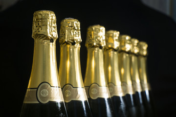 Collection of champagne or prosecco bottles © ink drop