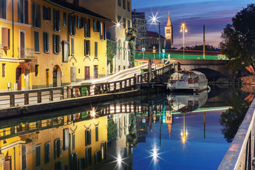 Fototapeta premium Bridge across the Naviglio Grande canal at sunrise, Milan, Lombardia, Italy