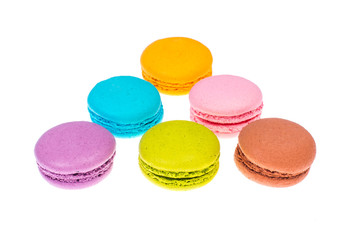 Fototapeta na wymiar Delicate delightful delicious colored macaroons on white background