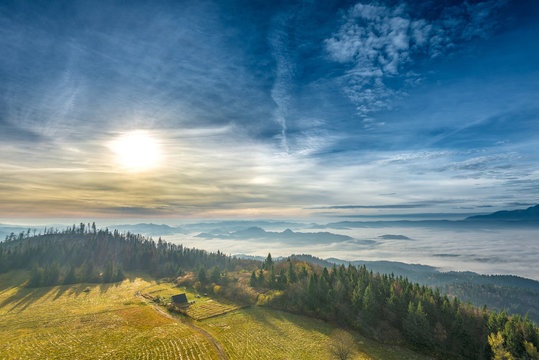 Misty sunrise landscape from Luban peak in Gorce mountains, Poland