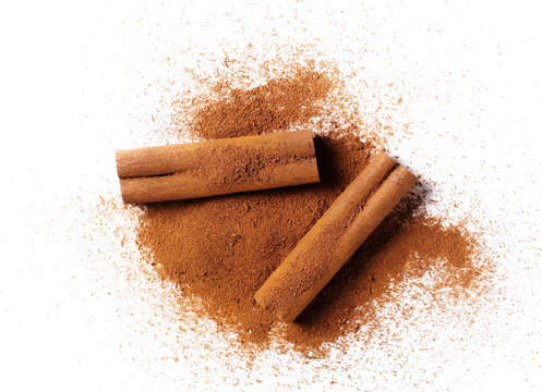 cinnamon sticks with powder isolated on white background