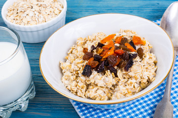 Porridge of oatmeal with dried fruits and chia seeds