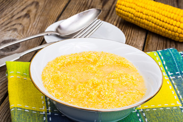 Dietary corn porridge on wooden table