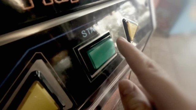 Pressing the start button of a game in slow motion.
