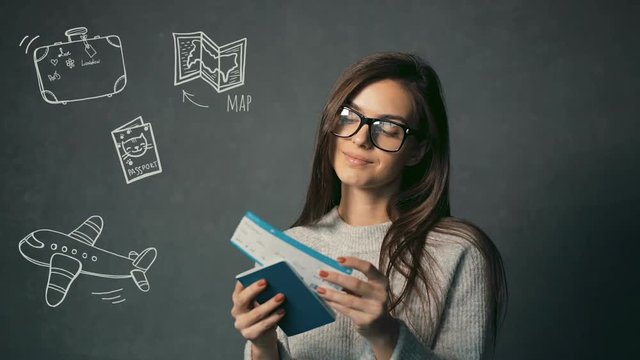 Attractive female traveller with passport and ticket in hands thinking about the holiday, isolated shot with travel animation icons