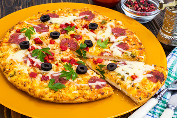 Delicious homemade pizza with salami
