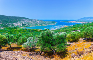 Fototapeta premium Wonderful romantic summer afternoon landscape panorama coastline Adriatic sea. Boats and yachts in harbor at magical clear transparent turquoise water. Cres island. Croatia. Europe.