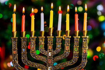 jewish holiday Hanukkah background with menorah traditional candelabra and burning candles...