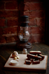 Garlic croutons on a on oiled paper. Photos atmospheric, rough, rustic style.