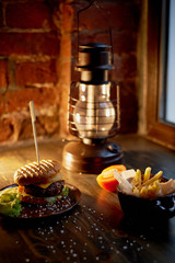 Wood top on her fries and Burger. The concept of the pub and fast food