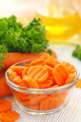 Salad with carrot, oil and greens