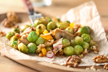 Plate with yummy brussel sprouts salad on table, closeup