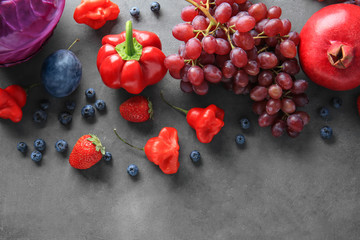 Composition of different fruits and vegetables on grey background