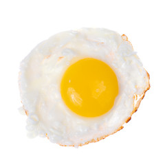 Brown wooden plate with fried egg
