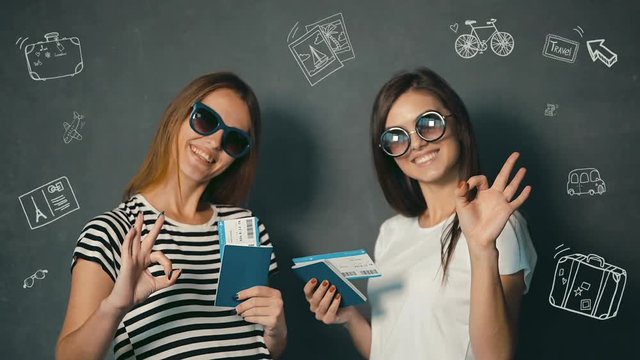 Happy female tourists showing tumbs up while holding the passports and tickets with travel animation icons