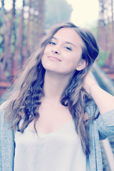 girl teenager smiling with her brown hair