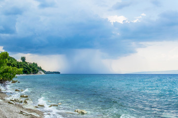 Fototapeta premium The rain falls in the horizon
