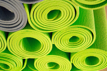 Fototapeta na wymiar Yoga mat on wooden floor