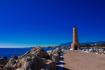 Fototapeta na wymiar Lighthouse. Port of Puerto Banus, Marbella, Costa del Sol, Andalusia, Spain. Picture taken – 21 november 2017.
