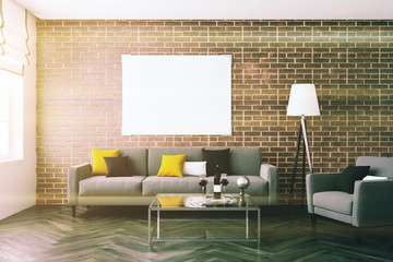 Brick wall living room, sofa, poster toned