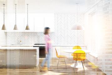 White wooden kitchen, yellow chairs blurred