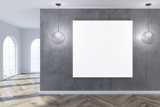 Empty gray room with a square poster