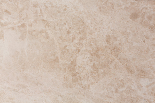 Beige marble background with natural pattern.