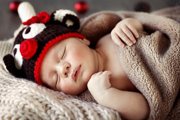 Cute baby sleeping in Christmas pajamas