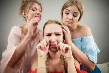 Woman being mad at two females