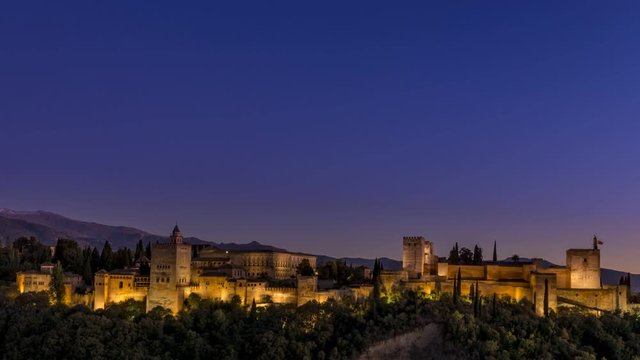 Classic view to Alhambra in Granada spain. Sunset to evening time lapse