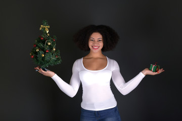afro american woman with christmas tree
