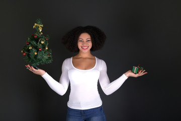 afro american woman with christmas tree