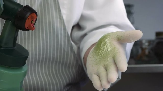 Confectioner checks the serviceability of the glaze tool