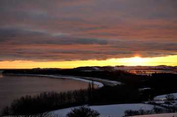 Sonnenuntergang im Winter über Mönchgut, Göhren und Groß Zicker