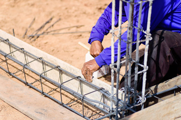 Construction work,the worker making formwork at construction site